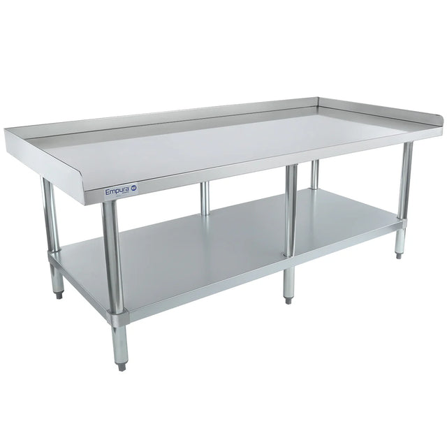 A stainless steel kitchen work table with a raised lip around the back and sides, an NSF-certified equipment stand, featuring an open lower shelf for storage. The clean, reflective surface is perfect for food prep in commercial or industrial kitchens.