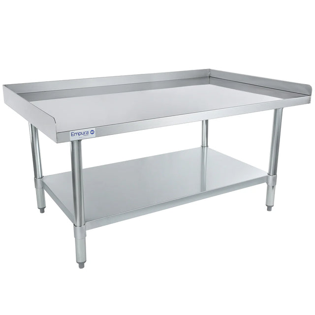 This Empura economy duty stainless steel work table features an undershelf for extra storage, raised edges on three sides, and a smooth top surface. Supported by four cylindrical legs, it’s ideal as an equipment stand in any busy kitchen.