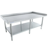 A large stainless steel work table with an undershelf and raised side and back edges. This NSF equipment stand features four sturdy legs with adjustable feet. The Entura brand name is visible on one side. The table is empty against a white background.