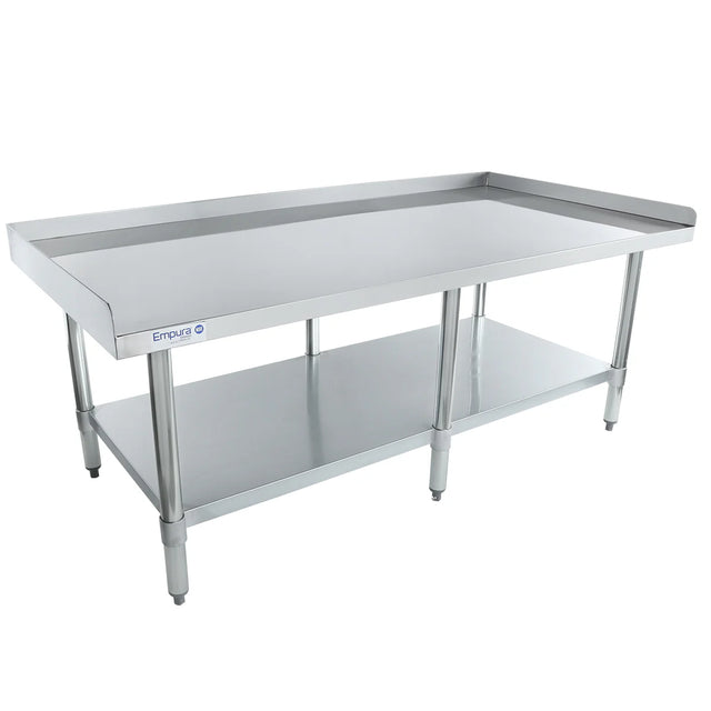 A large stainless steel work table with an undershelf and raised side and back edges. This NSF equipment stand features four sturdy legs with adjustable feet. The Entura brand name is visible on one side. The table is empty against a white background.