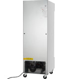 A tall, stainless steel commercial freezer on wheels, shown from the back. The bottom section exposes black cooling coils and a power cord, with caution and information labels visible on the upper and lower parts of the reach-in freezer.