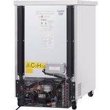 The image shows the back view of a commercial stainless steel ice maker on wheels, often used in commercial refrigeration. The compressor and cooling fan are visible at the bottom behind a black grille, with power cords and a C5H10 warning label above.