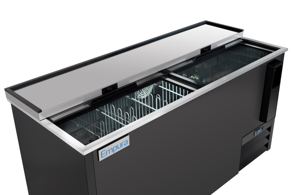 A commercial bottle cooler from Empura refrigeration features a sliding glass lid, black exterior, interior wire racks, and a visible cooling fan. The cooler is empty and clean, with the brand logo on the front and the sliding lid partially open to reveal the inside.