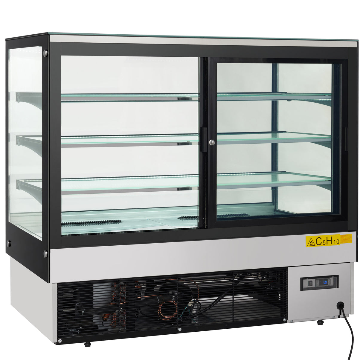 A commercial refrigerated display case with sliding doors, three glass shelves, and bright LED lighting. The lower section houses the cooling mechanism, visible through a vented panel with a yellow caution sticker and control panel on the front lower right corner.