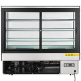 A commercial refrigerated display case with sliding doors and three clear glass shelves, enhanced by LED lighting. The lower section shows cooling components, a control panel, and a yellow “C5H10” refrigerant label. The unit is mostly black and silver.