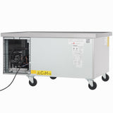 A rectangular stainless steel refrigerated stand with metal sides and four swivel caster wheels. The left side features an exposed compressor, a “C5H10” flammable gas warning label, and multiple instruction stickers—ideal Empura refrigeration for commercial use.
