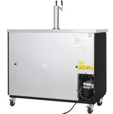 A large, silver and black commercial kegerator featuring a dual tap beer dispenser on top, ventilation grilles and compressor visible on the lower right side, warning labels, and four caster wheels for easy mobility.