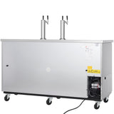 A large silver Empura Refrigeration Beer Keg Cooler with two beer taps on top, mounted on four wheels. Cooling vents and a power cord are visible on the right side, with yellow warning labels near the vent and upper right corner.