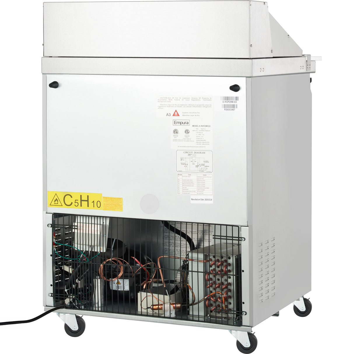 An Empura refrigeration unit on wheels with a white exterior. The bottom front panel is open, showing wiring, coils, and components. A C5H10 label and warning signs are visible. This refrigerated sandwich prep table sits on caster wheels for easy mobility.