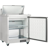 An Empura Refrigeration commercial stainless steel refrigerator with the top lid open and front door swung wide, showing interior shelves and a white, dimpled door lining—ideal as a Salad Prep Table. It’s on wheels with a digital control panel at the bottom front.