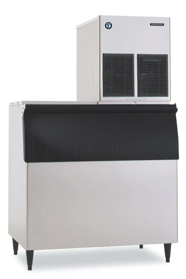 A Hoshizaki commercial ice maker with a stainless steel body and large black front-lid storage bin. The upper section has two rectangular vents and brand labels, and the unit stands on four short legs—perfect for producing cubelet ice.