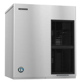 A stainless steel Hoshizaki ice maker with a rectangular shape produces cubelet ice, features front-right ventilation grilles, a brand logo on the top left, and a blue certification seal on the bottom left, all set against a white background.