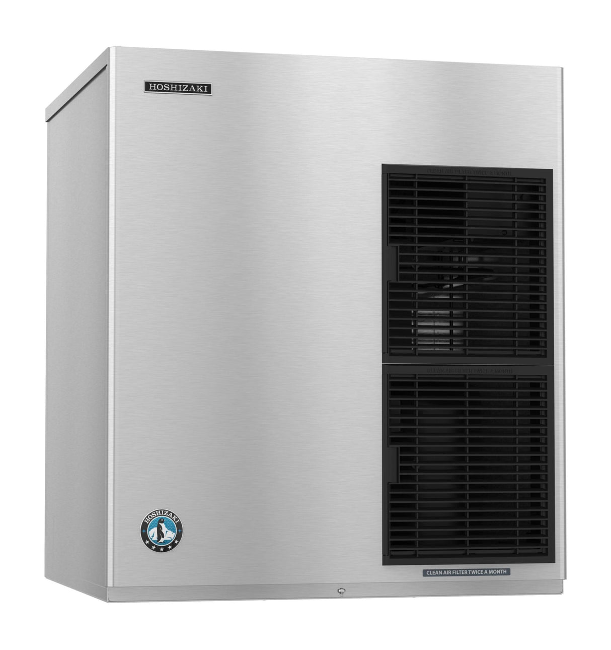 A large, stainless steel commercial Ice Maker with black vent panels on the front right side. The brand Hoshizaki label is in the upper left corner and a circular blue certification sticker on the lower left. Features high production capacity for busy environments.