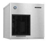 A stainless steel Hoshizaki ice maker with a rectangular shape, black front-left vent, and brand logos at the top corners. A label below the vent reads, “CLEAN AIR FILTER TWICE A MONTH.” This cubelet-style unit is set against a plain white background.