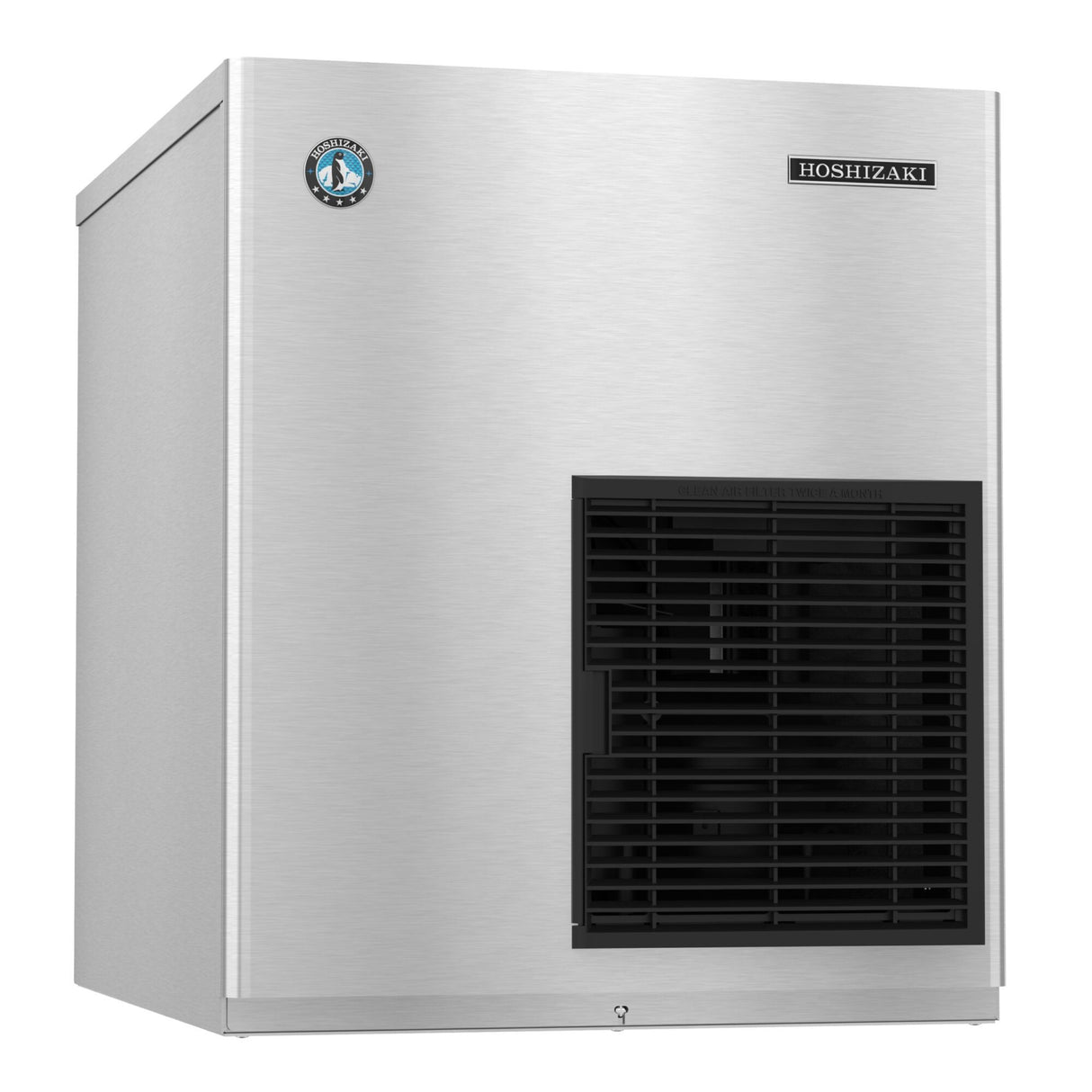 A stainless steel Hoshizaki Flake-Style Ice Maker with a smooth, boxy design. The front panel features a black vented grille on the lower right and a small circular blue logo on the upper left, with the Hoshizaki brand name at the top right.