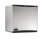 A sleek, modern stainless steel Scotsman Prodigy Plus Ice Maker with a smooth, rectangular front panel features the brand name at the top and a small digital display at the bottom left. The machine’s slight curves enhance its contemporary design.