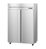 A large, commercial reach-in stainless steel refrigerator with two vertical doors, a digital display on the top right, ventilation grilles above the doors, and four small wheels. Its smooth, reflective surface features clean, modern lines.