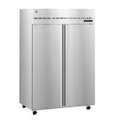 A large, stainless steel, double-door reach-in commercial refrigerator stands on four small wheels. The fridge features a vented panel above the doors, a digital temperature display on the right, and long vertical handles down each center.