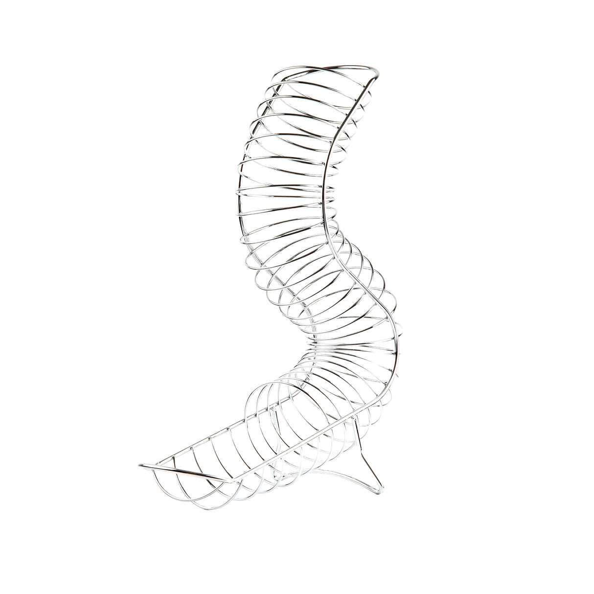 A silver metal slinky toy is twisted into an upright, curving S-shaped spiral, resembling a chrome plated fruit basket, against a plain white background. The stretched coils form a dynamic and abstract sculptural shape.