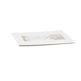 A single rectangular sheet of white corrugated polyethylene plastic with a laminated instruction label on top, photographed from a low angle on a white background. The item is thin and slightly bent, with the edges and layered structure visible.