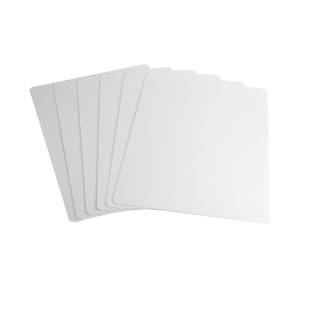 Six blank, rectangular white polyethylene sheets are fanned out on a white background. Each sheet, resembling a dishwasher safe cutting mat with rounded corners, is evenly spaced and slightly overlapping for a neat, organized arrangement.