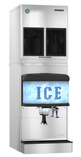 A large, silver Hoshizaki commercial ice maker features a rectangular ice bin labeled “ICE” in big blue letters. The upper section contains vents and controls, while the lower section offers a dispenser chute and water faucet for cubelet-style ice.
