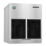 A commercial stainless steel Hoshizaki Cubelet-Style ice maker with dual black ventilation grilles on the front, a Hoshizaki logo at the top right, and a small blue circular sticker. The front panel features a label: “CLEAN AIR FILTER TWICE A MONTH.”.