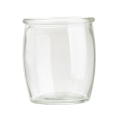 A clear, empty 4 oz glass jar with a wide mouth and rounded body, resting on a white background. Featuring a slight lip at the rim and smooth, transparent sides, this piece echoes vintage style glasses from TableCraft Products.