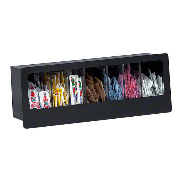 A black rectangular condiment dispenser with a clear front panel and built-in design features seven vertical sections, each neatly holding packets of sugar, sweeteners, and creamers in various colors including white, yellow, brown, blue, and pink.