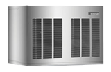 A large, rectangular, silver standalone metal unit with multiple black ventilation grilles on the front and side. Labeled “Goodman” in the upper right corner, it resembles a high capacity ice machine or HVAC system against a plain white background.