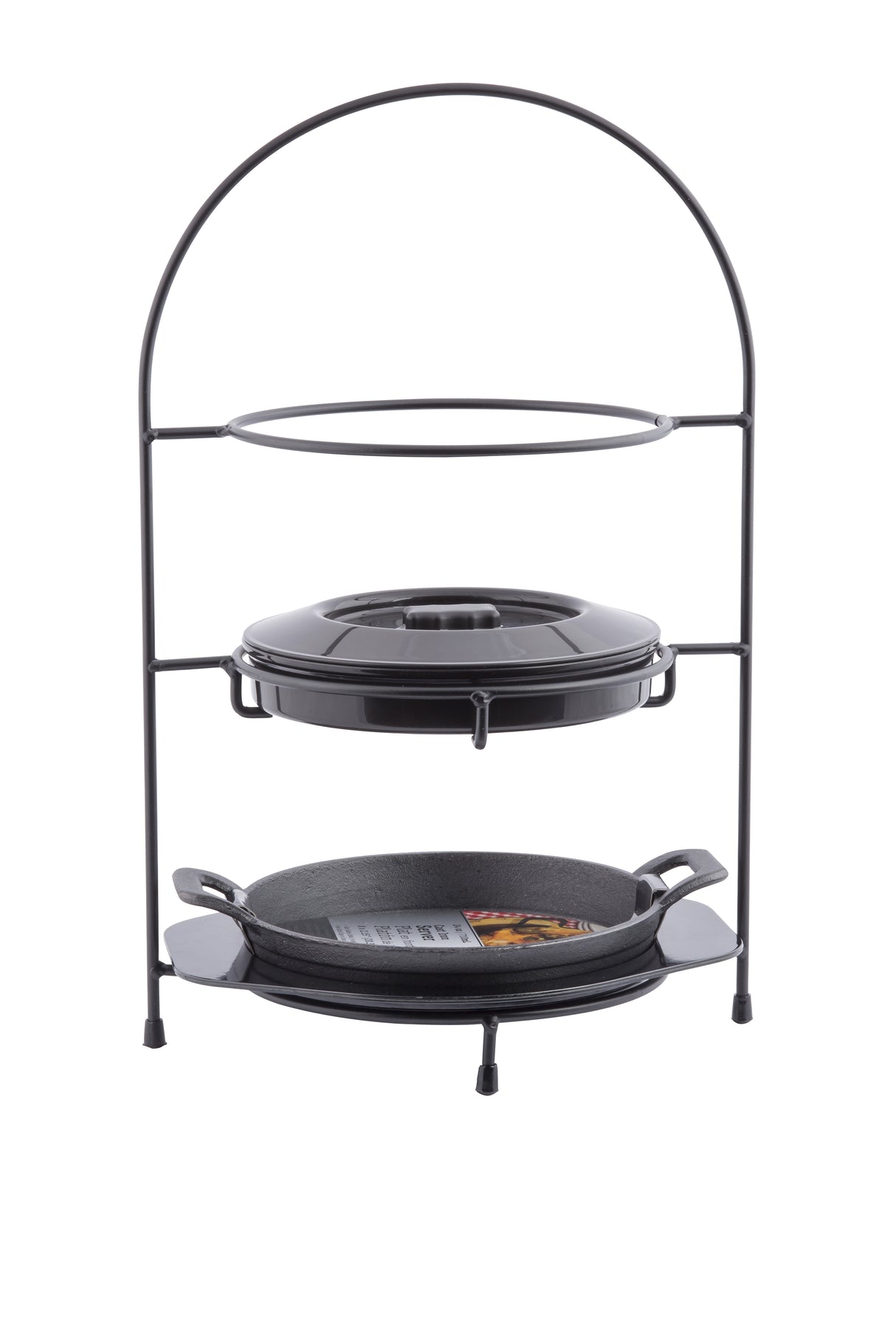 A black metal two-tier stand holds a lidded pot, perfect as a tortilla warmer on the upper shelf, and a cast iron fajita platter-style handled skillet on the lower shelf. Both items are black with the stand featuring four short feet and a rounded top handle.