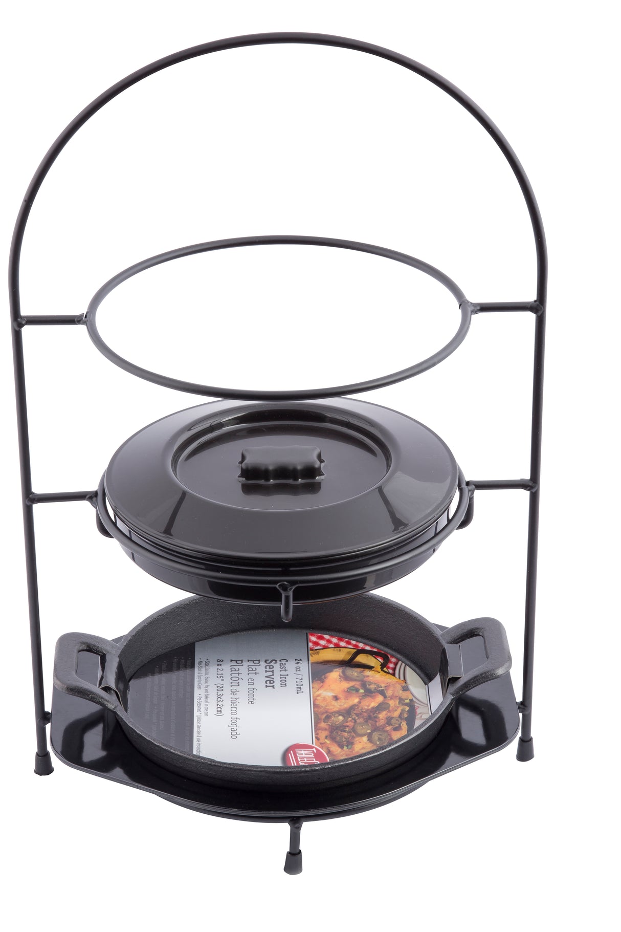 A black metal Fajita Tower Kit holds a round lidded cast iron Dutch oven above and a shallow cast iron fajita platter with handles below, displaying a paper insert with cooked food imagery. The background is white.