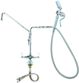 A chrome-plated pantry deck mount faucet with dual handles, a long spout on the left, and a flexible washdown hose with a blue nozzle on the right. Includes hot and cold water hoses at the bottom for efficient commercial kitchen use.