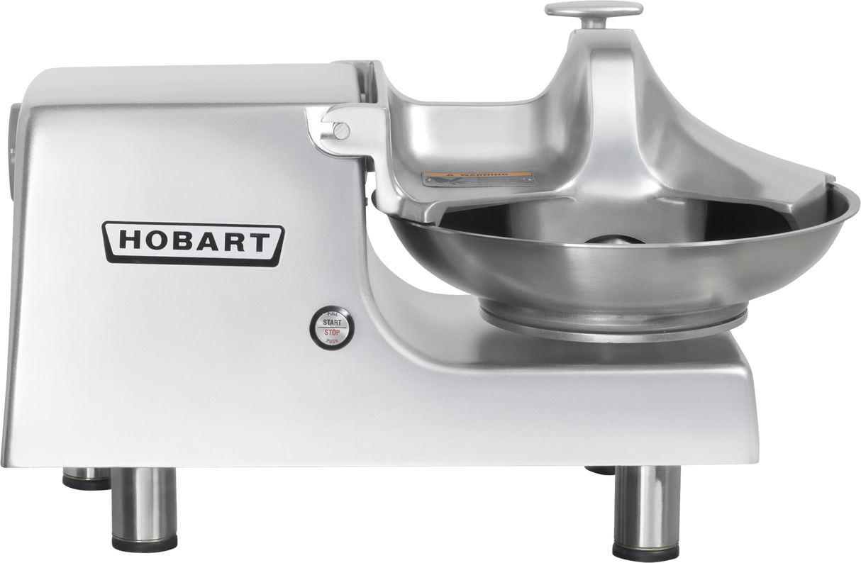 A silver Hobart Food Cutter with a large stainless steel bowl, flat-topped control knob, and sturdy four-legged base. The Hobart logo stands out on the machine’s side, emphasizing its commercial quality and reliability.
