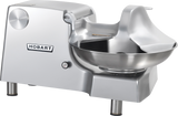 A Hobart 84186-1 commercial food cutter with a large stainless steel bowl, safety shield, and sturdy base. Designed for efficient chopping or mixing in kitchens, it features the Hobart logo and an easy-to-use control knob.