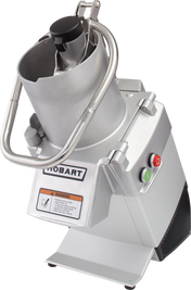 A commercial Food Processor with a sturdy stainless steel body and continuous feed chute, branded Hobart. It features a large handle, black lid, labeled red and green buttons, warning label, and robust base—ideal for professional kitchens.