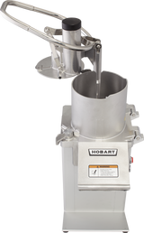 A commercial Hobart hamburger patty press with a stainless steel lever and cylindrical chamber for forming patties. The upright machine, featuring a warning label and Hobart logo, has its handle lifted to expose the pressing area.