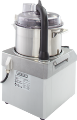 A commercial-grade Hobart Food Processor with a 4 qt. stainless steel bowl, black handle, and clear plastic lid sits on a gray base displaying a product label. The machine features a power cord and an angled spout on the front left.