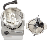 A silver Hobart Food Processor with a 6 qt. bowl reveals sharp COOLCUTTER knives inside, next to a transparent lid featuring black handles and feed tubes; the control dial is set to off.