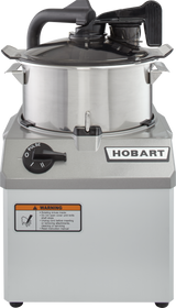 A stainless steel commercial Food Processor with a 6 qt. bowl, lidded design, black handle, “HOBART” branding, large “PULSE” dial, and warning label. The machine sits on a gray base with metallic accents and features COOLCUTTER knives.