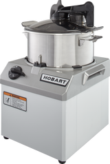 A Hobart commercial Food Processor with a 6 qt. bowl, stainless steel lid, black handle, and control knob on a silver and white base. Featuring COOLCUTTER knives, this sturdy machine has a warning label and brand logo for industrial kitchen use.