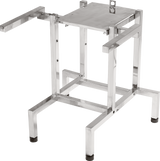 A metallic, rectangular frame with four vertical legs, horizontal supports, and rubber feet; the top has a flat platform with a handle and two arms extending outward, designed as an FP100 mount or food processor stand for industrial settings.
