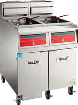 A high efficiency Vulcan gas fryer with 50 lbs. capacity, featuring dual baskets, digital controls, and a stainless steel exterior. It stands on wheels with two lower storage cabinets and certification badges on the bottom right.