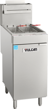 A Vulcan floor model fryer with two wire baskets and red handles sits atop a storage compartment. This commercial stainless steel natural gas fryer stands on four metal legs and features a paper towel holder on top.