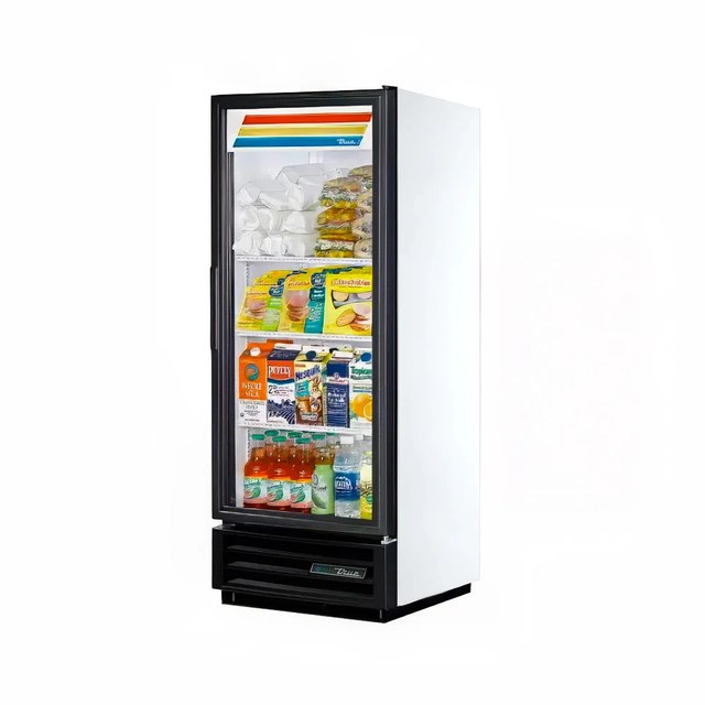 A tall, single-door commercial display refrigerator with a glass front neatly showcases milk cartons, food containers, snack packs, bottled juices, and drinks. The top panel features colorful horizontal stripes in yellow, orange, green, and blue.