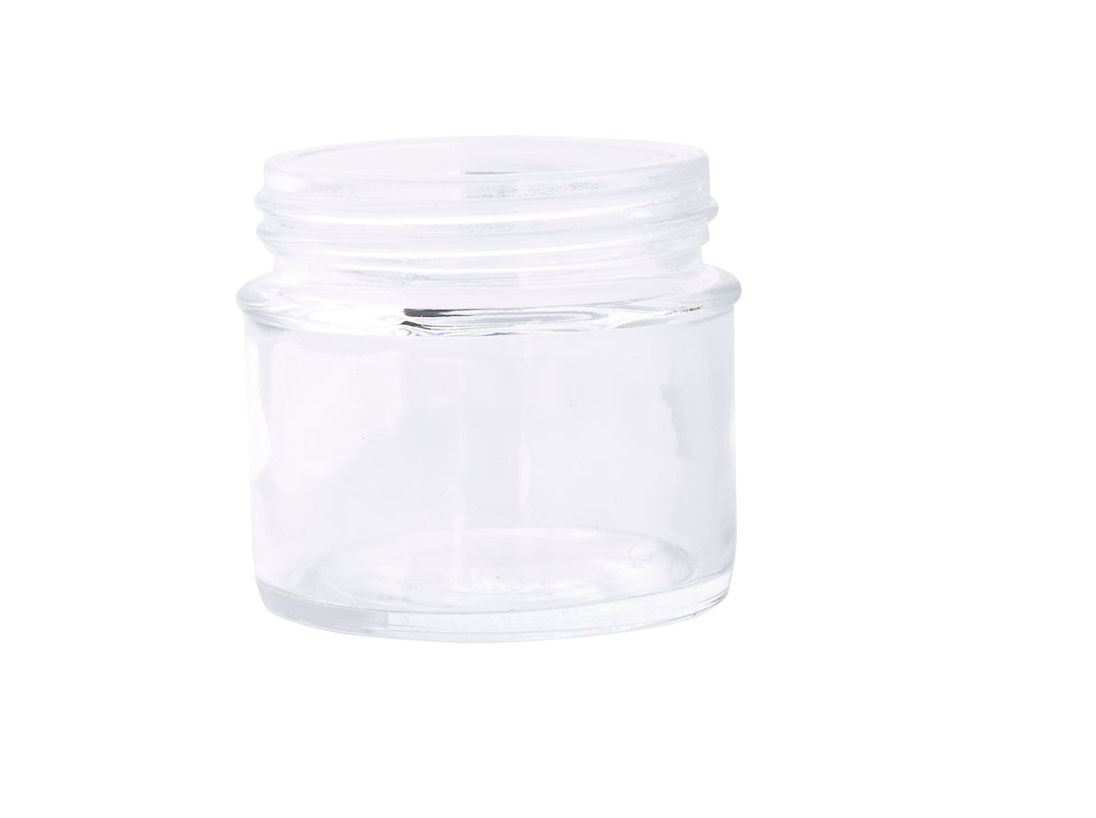 A small, empty, clear 3 oz. tasting jar with a wide mouth and no lid is shown against a plain white background. The cylindrical glass reflects light, making its transparent surface appear shiny and clean.