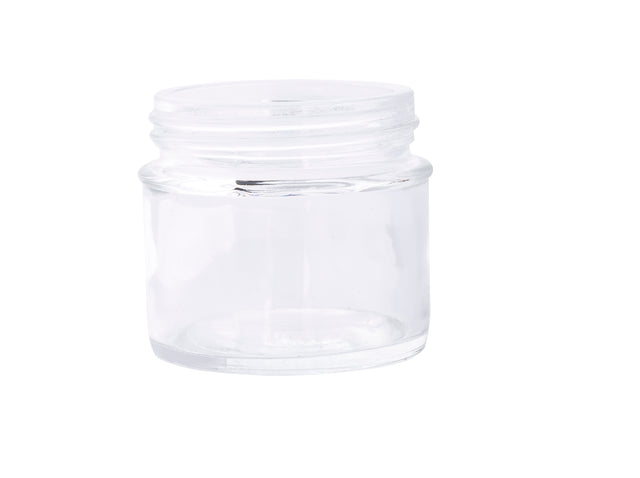 A small, empty, clear 3 oz. tasting jar with a wide mouth and no lid is shown against a plain white background. The cylindrical glass reflects light, making its transparent surface appear shiny and clean.
