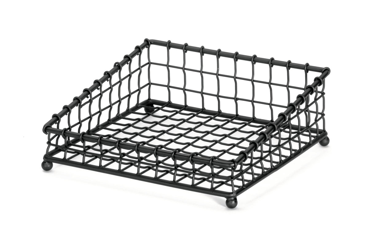 A black powder coated metal, square-shaped wire mesh tray with a grid pattern, raised edges, and four rounded feet. Part of the Grand Master Collection Basket by TableCraft Products, it’s designed for holding items like napkins or papers.