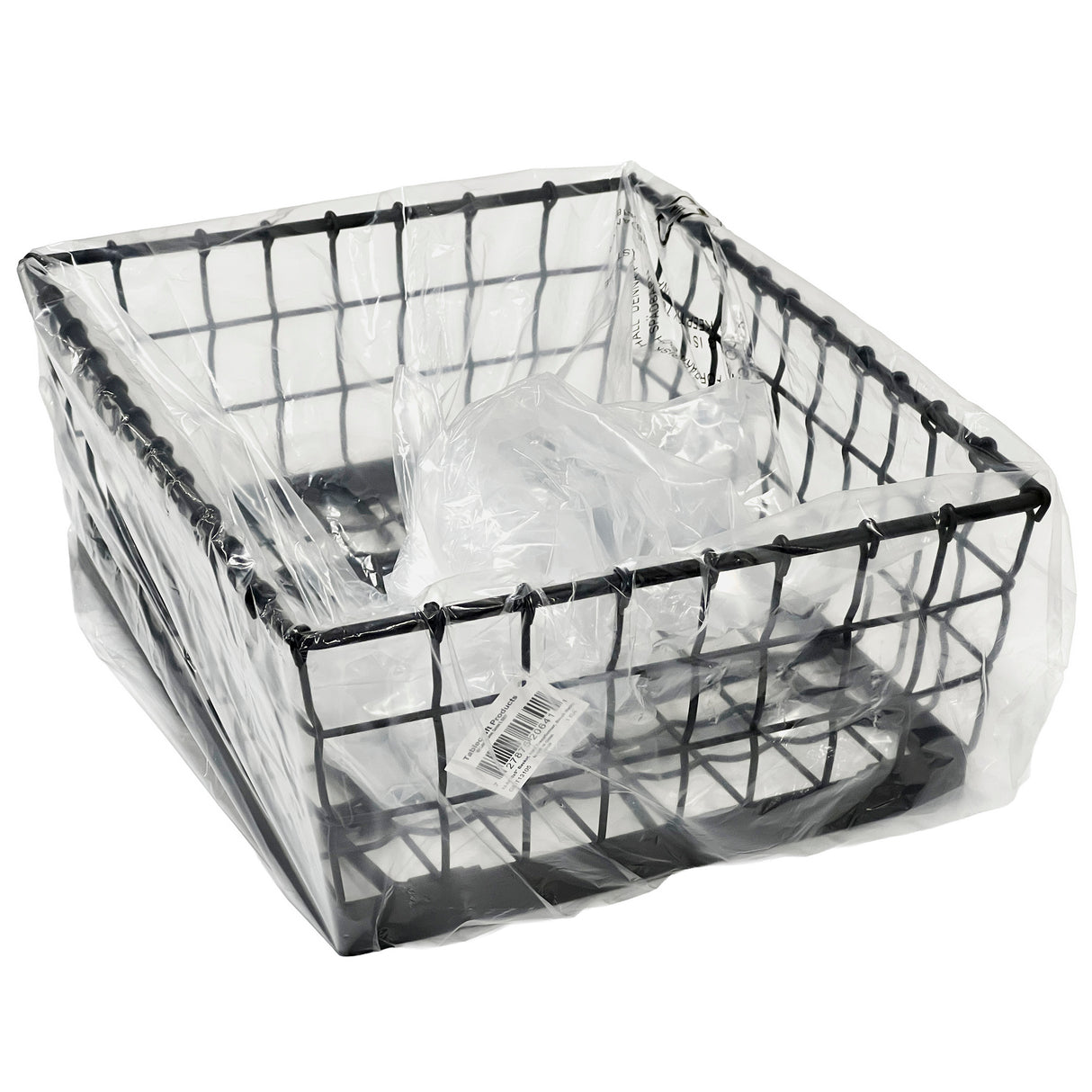 A black powder coated Transformer Basket, square-shaped and partially covered with a clear plastic bag, features a barcode sticker on the bottom. The photo is taken against a plain white background, resembling a sturdy food pan holder.