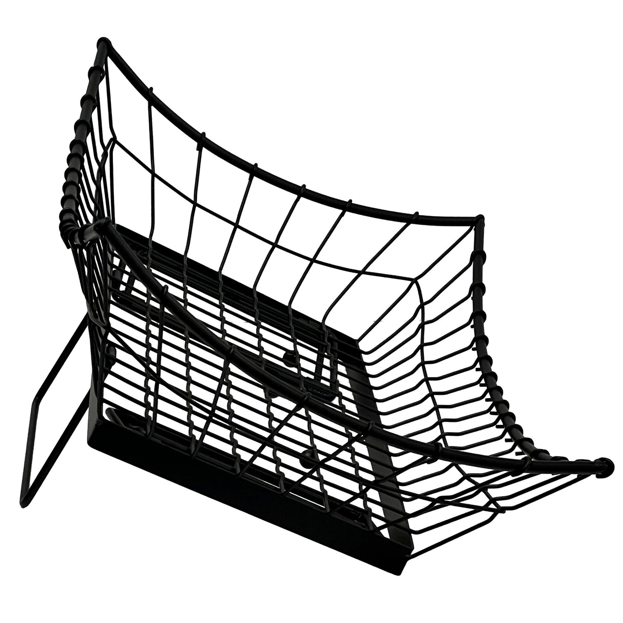 A black wire mesh Transformer Basket desk organizer tray, viewed from an angle, shows its curved basket shape and open grid design; it sits on a flat base with two supporting side bars, all set against a white background.